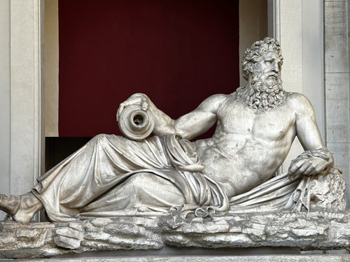 A reclining marble statue in the Vatican Museums